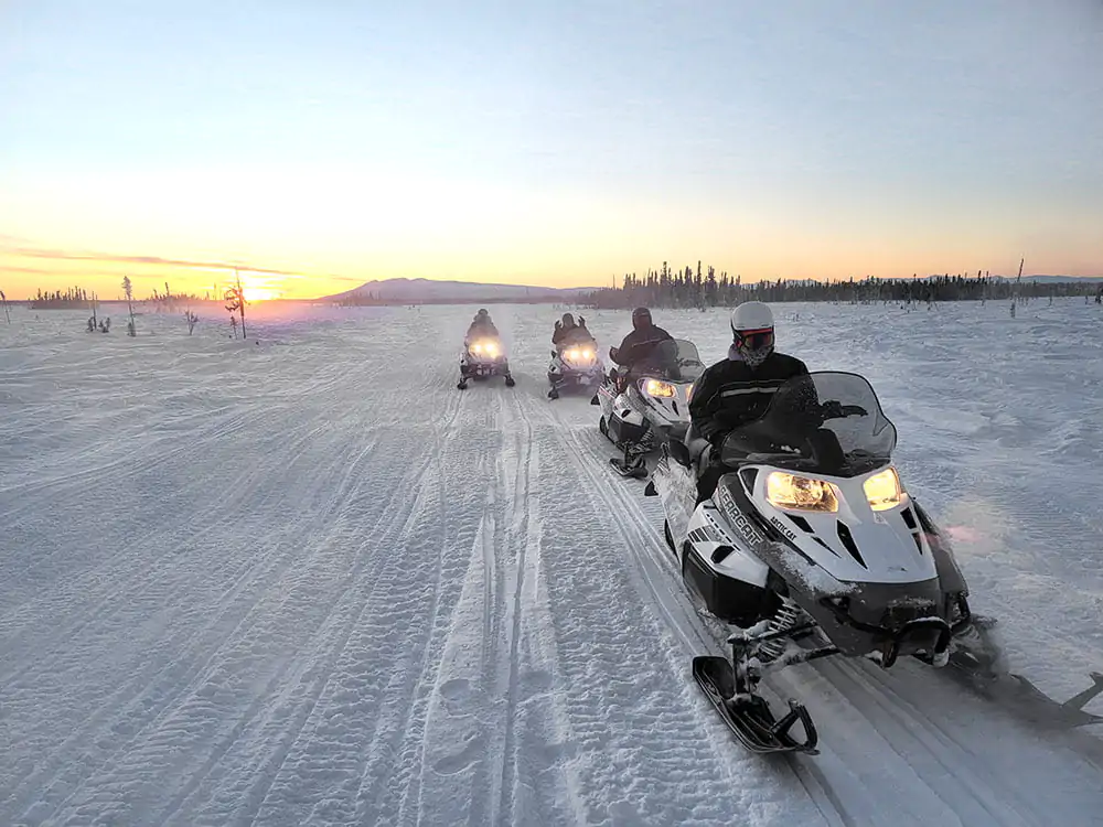 Snowmobiles in Sunset2